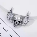 Vintage silver winged skull brooch with detailed antique finish on a white display - Vintage Distressed Winged Skull Style
