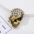 Vintage gold pirate skull brooch with rhinestones and black enamel eye detailing - Pirate Style Headscarf Skull Brooch Style