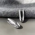 Silver elongated teardrop earrings with a polished finish and modern snap closure - Silver