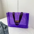 Chic purple transparent PVC tote bag with stylish fabric handles and secure snap button - Purple