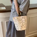 Canvas bucket bag featuring black cat patterns and brown handles for daily use - MIMI Cat