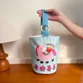 Canvas bucket bag featuring pink pony illustration and blue striped pattern design - Happy Horse