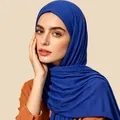 Detail of royal blue muslin hijab showing soft cotton texture and drape on a model - One Size / Sapphire Blue