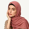 Close-up of elegant dusty rose ethnic style hijab with textured fabric and black inner band - One Size / Dusty Rose