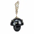 Detailed view of mushroom-shaped acrylic clutch with marble pattern and gold metal studs - Black