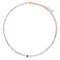 Halskette aus lila Kristallperlen mit weißem Herz-Auge-Anhänger und Golddetails - Lila (FN1231)