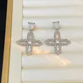 Detail of silver floral drop earrings with pavé cubic zirconia and twisted rope texture - Silver (925 Sterling Silver Earring Post)