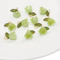 DIY light green lily of the valley acrylic flower charms with gold jump rings and leaf details - Green