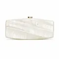 Detail of pearlescent acrylic evening clutch featuring geometric faceted design and gold clasp - Milky White