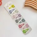 Set of 10 candy-colored star-shaped BB hair clips displayed on a white display card - 3-Long Tail Star