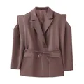 Detail of waist-belted mauve blazer with unique padded cape-shoulder layering - Dusty Rose