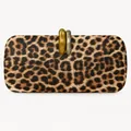 Detailed view of the leopard print evening clutch with a gold and silver interlocking clasp - Amber (Leopard Print)