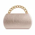 Detailed view of champagne gold evening clutch with crinkled texture and chunky chain - Lotus Pink