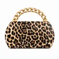 Detail of the leopard print PU leather bag featuring a bold gold chunky metal chain handle - Amber