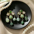 2605060 Green Teardrop Tassel Earrings
