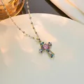 Gold cross necklace featuring a pink center stone and colorful zircon inlays on white silk - Silver Multi-color Zirconia (Pink Center)