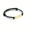 Detail of adjustable black braided rope bracelet with a polished gold curved metal plate - Black Rope + Gold Color Plate