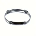 Detail of minimalist woven grey cord bracelet with polished black stainless steel plate - Grey Rope + Black Plate