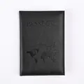 Minimalist black PU leather passport holder with embossed world map and airplane design - Black