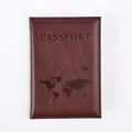 Macro view of dark brown PU leather passport cover with embossed map and flight path - Burgundy