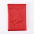 Detail of red PU leather passport cover with embossed world map and aircraft pattern - Red