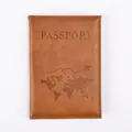 Brown textured leather passport cover with embossed world map and airplane flight path - Brown