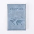 Detail of light blue PU leather passport cover with world map and airplane design - Light Blue