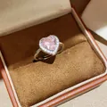 Detailed macro view of heart-shaped pink gemstone ring with halo zircon in jewelry box - One Size(Adjustable) / Silver Pink Zirconia