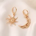 Gold asymmetric star and moon huggie hoop earrings on smooth white silk fabric - KC Gold (S128)