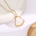 Gold Buddha necklace with translucent white pendant and sparkling zircon accents - White