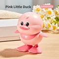 Mechanical pink duckling wind-up toy with a white heart detail for crawling fun - Wind-up Jumping Duck (Pink)