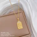 Macro detail of gold Virgin Mary rectangular pendant with cross and crystal inlay - Cross Virgin Mary Rectangular Plate Style(5)
