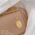 Close-up of gold Virgin Mary pendant with cubic zirconia inlay and hollow lace heart edge - Virgin Mary Heart Lace Style(16)