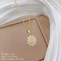 Macro detail of gold Virgin Mary pendant with sunflower frame and zircon inlay settings - Virgin Mary Sunflower Style(24)