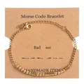 Detail of Morse code bracelet featuring gold beads and tubes on a handmade display card - Gold (Bad Ass)