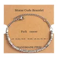 Silver Morse code bracelet with beads and tubes displayed on a brown kraft card - Silver (Fuck Cancer)