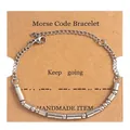 Detail of Morse code bracelet on kraft paper card with Keep Going text and beads - Silver (Keep Going)