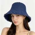 Deep blue washed cotton bucket hat with frayed edges shown on a fashion model - M / Navy Blue