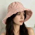 Detail showing the frayed edges and cotton canvas texture of the pink bucket sun hat - M / Pink