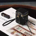 Mini black lychee leather makeup bag with gold zipper and convenient hand strap - Black