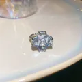 Anello quadrifoglio in argento con pietre azzurre e fascia con trama a corda - Anello