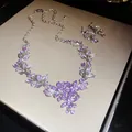 Detailed shot of purple crystal floral necklace and earring jewelry set on beige display - Purple Floral Marquise Cut Style (17#)
