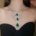 Close-up of a three-tier necklace with sparkling green teardrop pendants and rhinestones - Three-Layer Green Gemstone Style (22#)