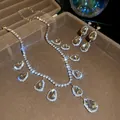 Close-up of luxury rhinestone teardrop pendant necklace and earrings set in a box - Champagne Water Drop Pave Style (23#)