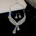 Close-up detail of silver-toned pear-shaped rhinestone necklace and earrings set - V-Shape Pear Cut Fringe Style (27#)