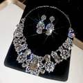 Luxury silver-tone rhinestone jewelry set featuring teardrop pendants and matching earrings - Cut-Out Floral Water Drop Style (62#)