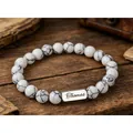 Macro view of white turquoise beads and personalized engraved metal bar with Thomas - 1 Side Engraving / Howlite