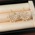 Elegant gold-plated geometric round earrings with pearls and cubic zirconia stones - Gold