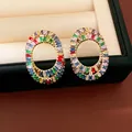 Detailed close-up of luxury oval stud earrings inlaid with vibrant multi-color zircon stones - Colorful