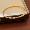 Macro detail shot of a gold stainless steel bangle bracelet with sparkling zircon accents - 4# Bangle-Gold